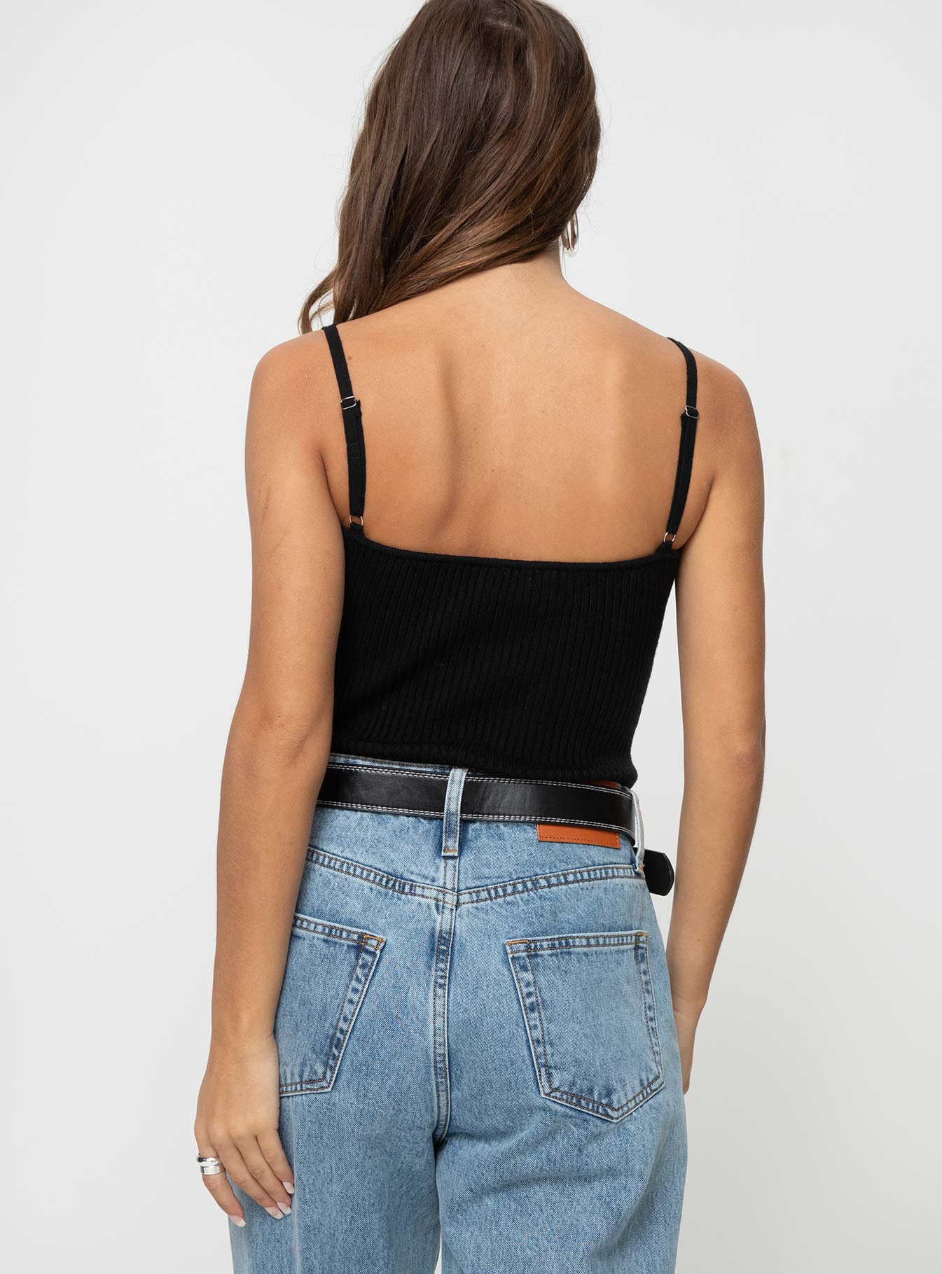 back view of model wearing Princess Polly Keenan Bodysuit Black Sleeveless V-Neck 