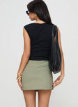 back view of model wearing Princess Polly Maceline Wrap Front Skort Green 