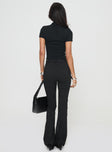 back view of model wearing Princess Polly Pagano Pinstripe Flare Pants Black High Waisted Pants 