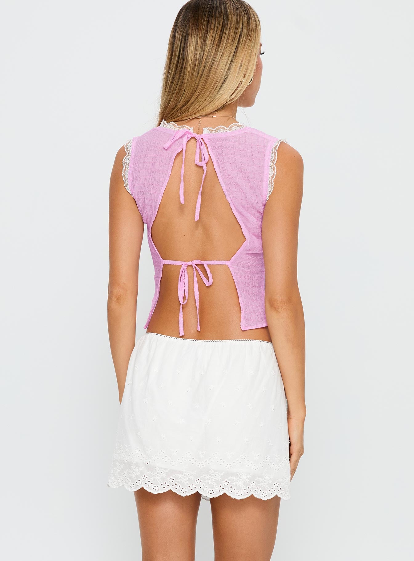 back view of model wearing Princess Polly Wish Upon Broderie Mini Skirt White Mini Skirts 