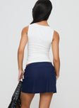 back view of model wearing Princess Polly There She Goes Skort Navy Low Rise Shorts 