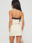 back view of model wearing Princess Polly Team Mini Skirt Cream Mini Skirts 