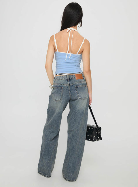 back view of model wearing Princess Polly Zaralyn Low Rise Wide Leg Jeans Mid Blue Wash Low Rise Jeans 