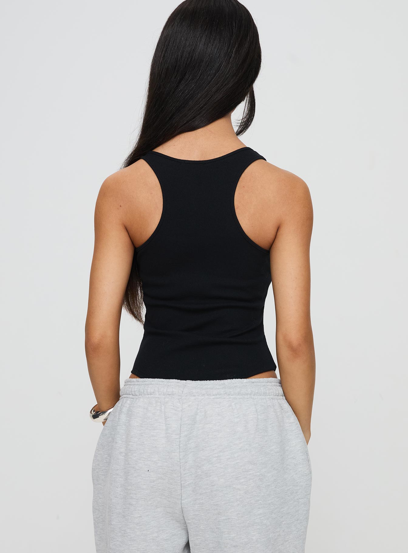 back view of model wearing Princess Polly Novelle Bodysuit Black Sleeveless Square Neck 