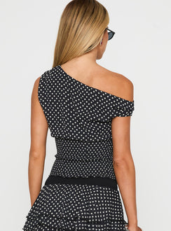 back view of model wearing Princess Polly Ready To Party Off Shoulder Top Black Polka Sleeveless Asymmetric Neckline 