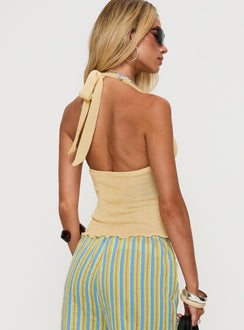 back view of model wearing Princess Polly Leam Top Butter Sleeveless Plunger 