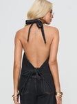 back view of model wearing Princess Polly Hills Halter Washed Black Sleeveless Plunger 