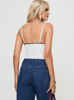 back view of model wearing Princess Polly Rune Top White / Black Sleeveless Plunger 