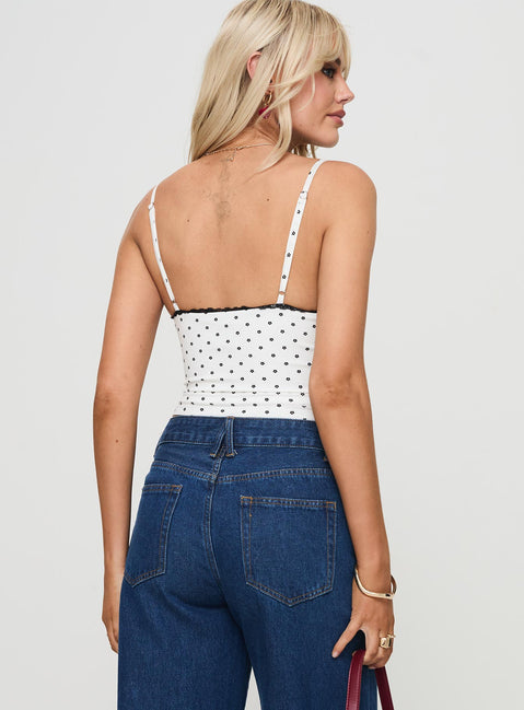 back view of model wearing Princess Polly Rune Top White / Black Sleeveless Plunger 