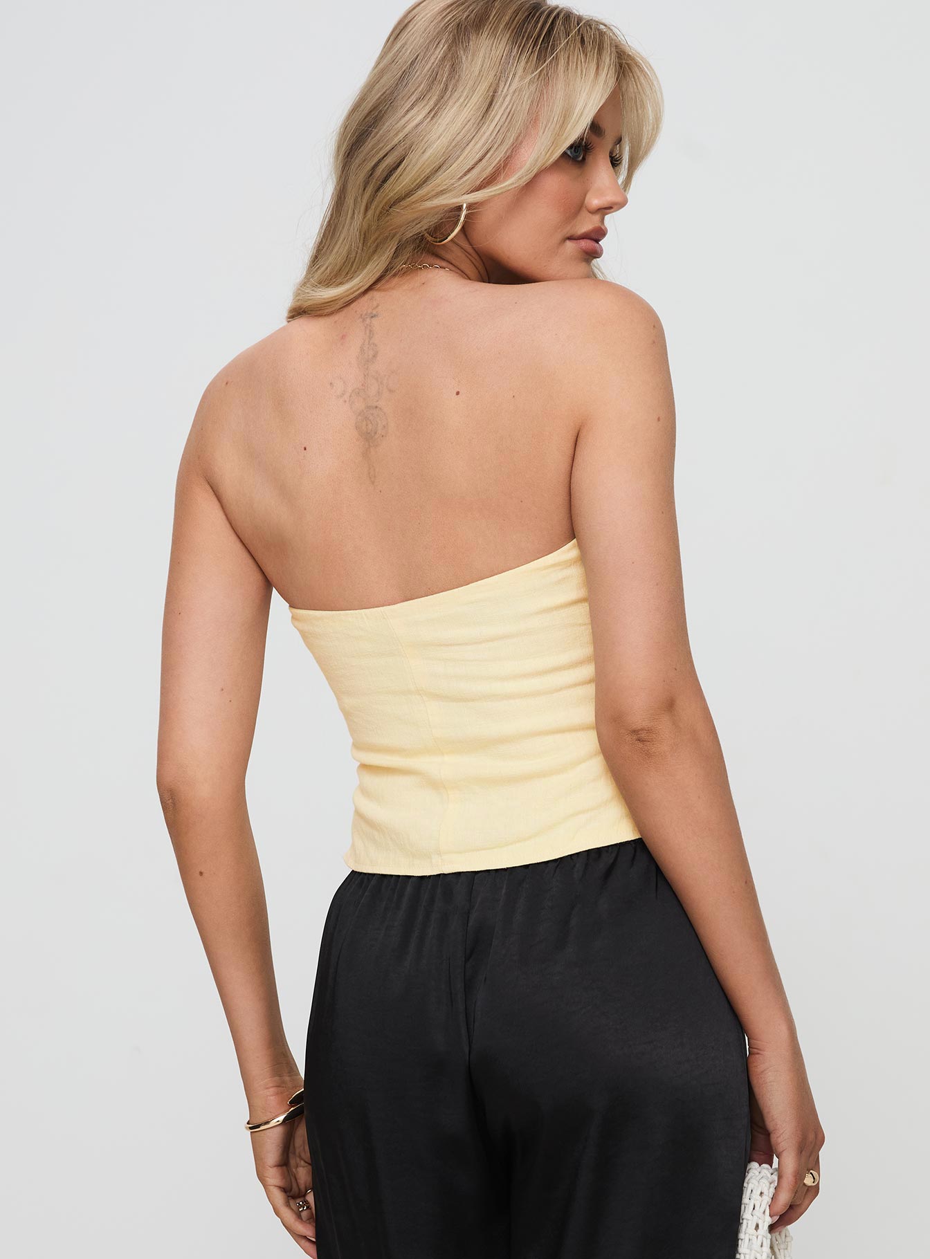 back view of model wearing Princess Polly Birdie Asymmetric Linen Blend Top Lemon Sleeveless straight 
