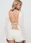 back view of model wearing Princess Polly Maddalyn Crochet Top White Full Sleeves Boat Neck 