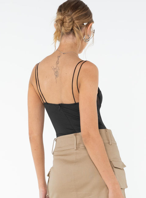 back view of model wearing Princess Polly Bamba Bodysuit Black Sleeveless 