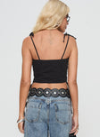 Denim cargo top Straight neckline, adjustable tie straps, twin breast pockets, exposed zip fastening, tie details at side Non-stretch material, unlined 