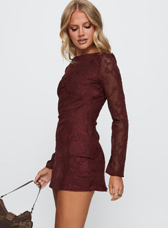 side view of model wearing Princess Polly Jadee Long Sleeve Mini Dress Burgundy Floral Crew Neck 