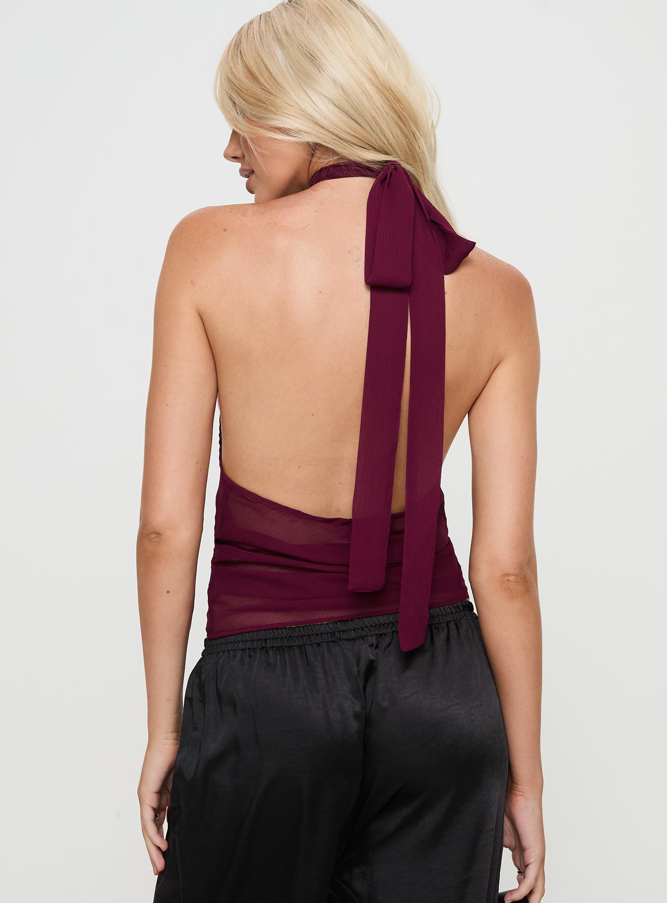 back view of model wearing Princess Polly Lux Tie Top Burgundy Sleeveless High Neck 