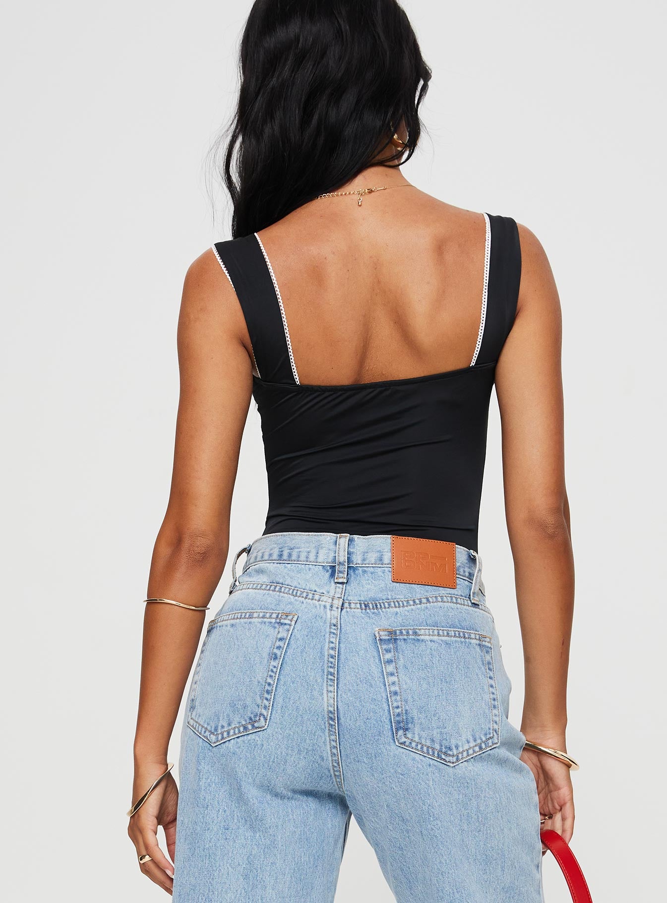 back view of model wearing Princess Polly Keating Bodysuit Black Sleeveless 