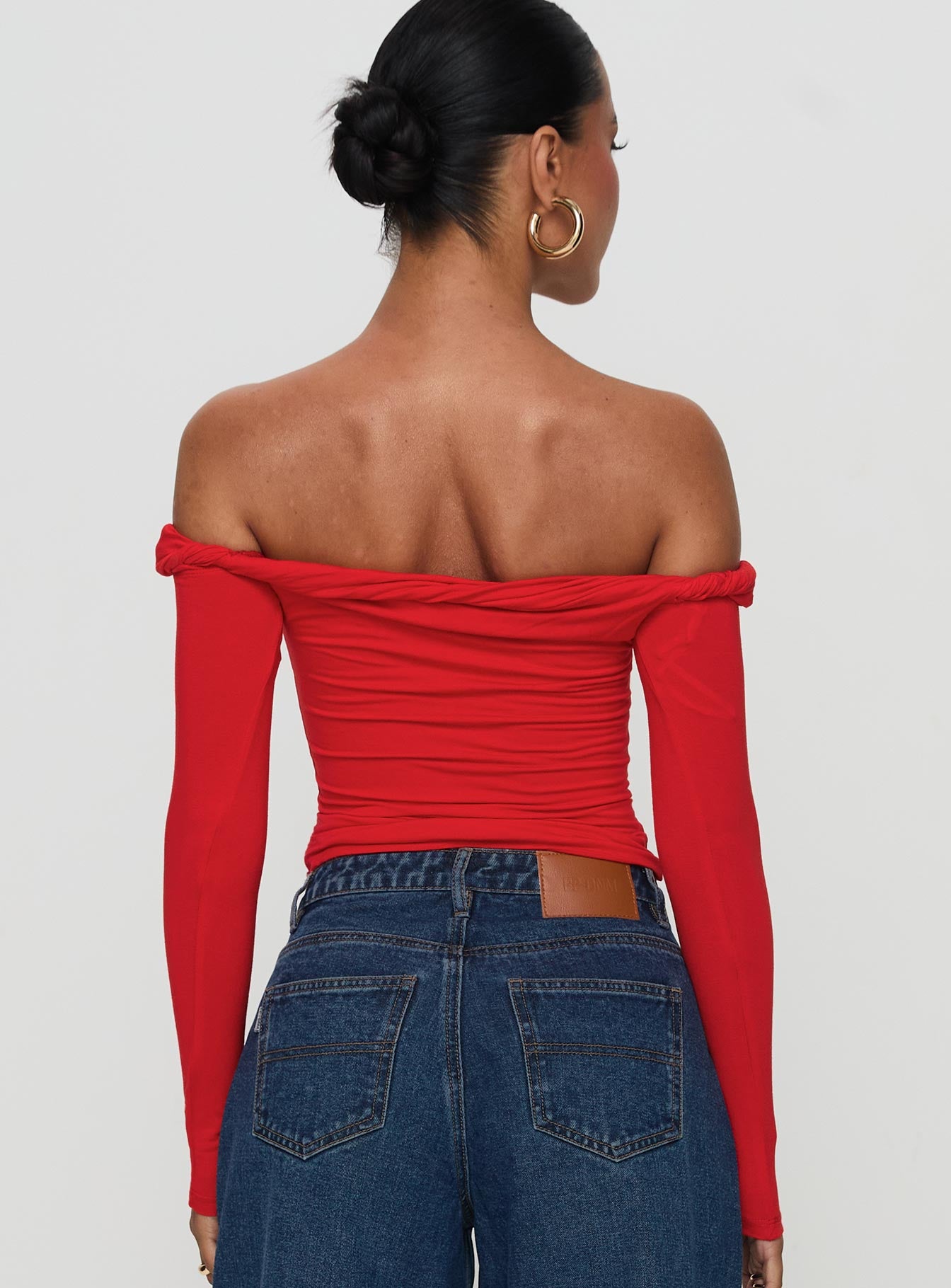 back view of model wearing Princess Polly Dusky Long Sleeve Top Red Full Sleeves straight 