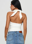 Halter neck top Twist bust tie fastening at back of neck, invisible zip fastening at side Good stretch, fully lined