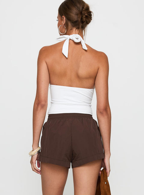 back view of model wearing Princess Polly Borderline Track Short Brown / Blue High Waisted Shorts 