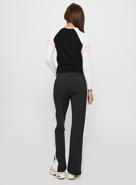 back view of model wearing Princess Polly Track Star Pants Black Low Rise Pants 