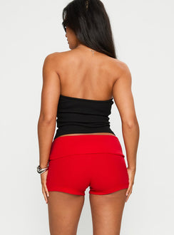 back view of model wearing Princess Polly Baseline Low Rise Rib Shorts Red Low Rise Shorts 