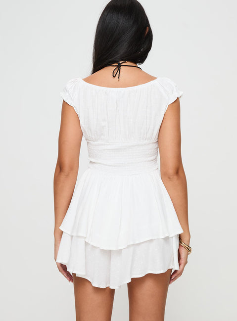 White Romper Cap sleeves, cross over tie fastening at bust, elasticated waist, layered hem