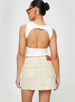 back view of model wearing Princess Polly Hughes Mini Skirt Cream Denim Mini Skirts 