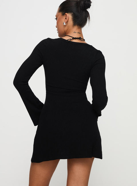 back view of model wearing Princess Polly Best Interest Long Sleeve Mini Dress Black Petite Scoop Neck 