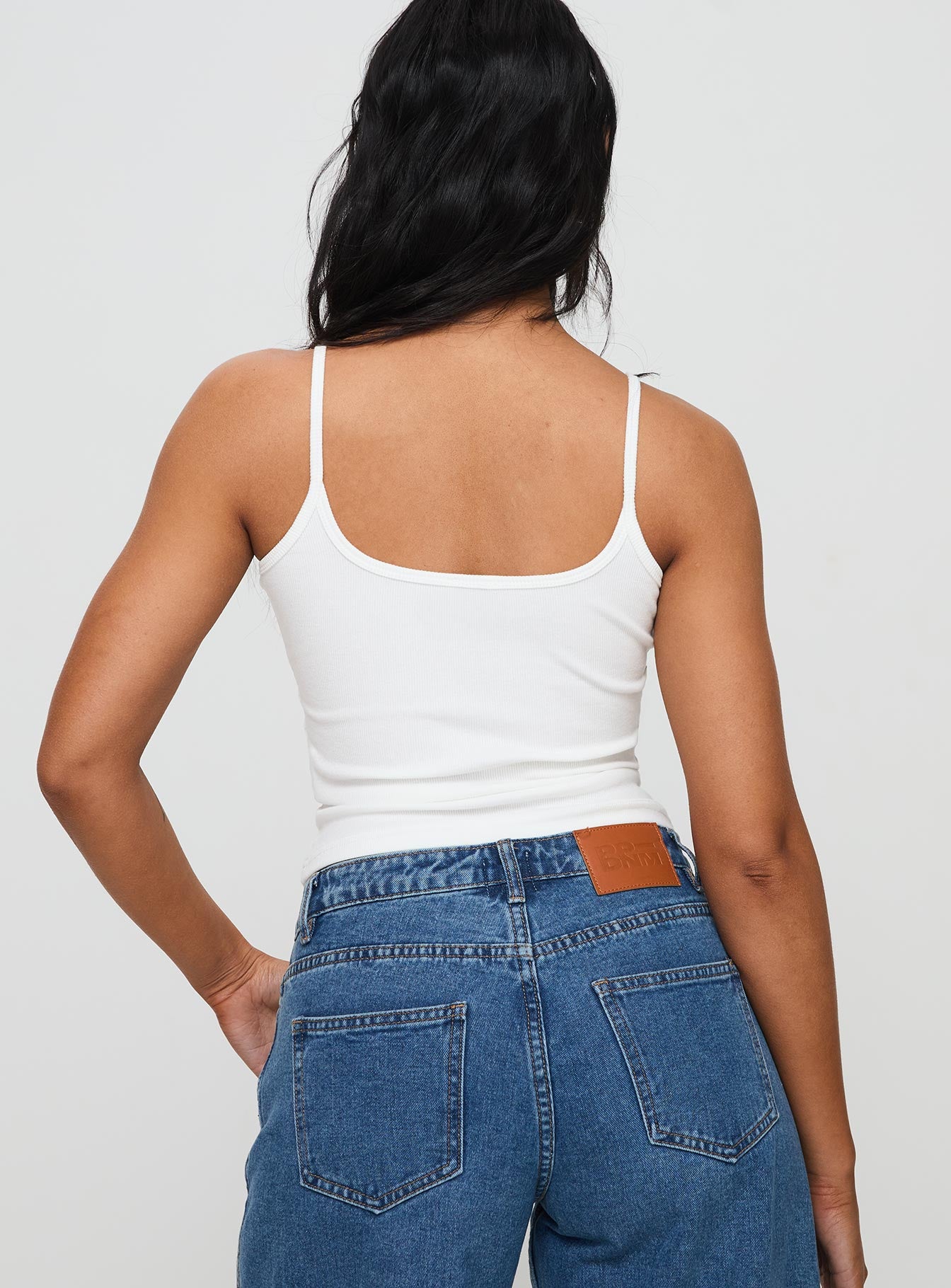 back view of model wearing Princess Polly Baseline Rib Top White Sleeveless Square Neck 