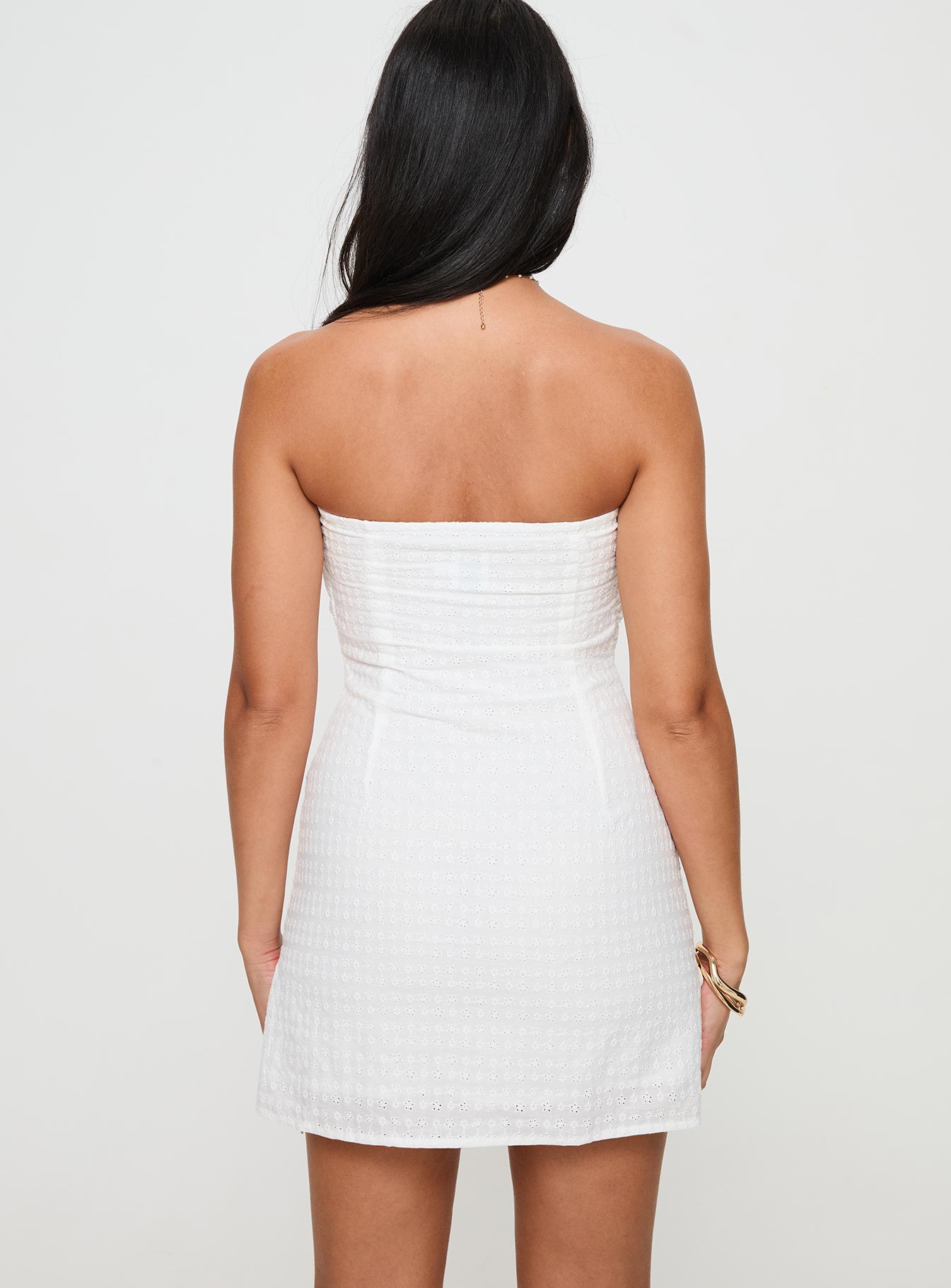 back view of model wearing Princess Polly Irena Broderie Strapless Mini Dress White Sweetheart Neckline 