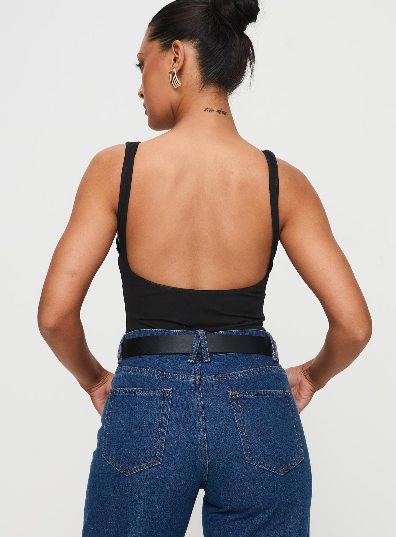back view of model wearing Princess Polly Nellie Bodysuit Black Sleeveless Plunger 