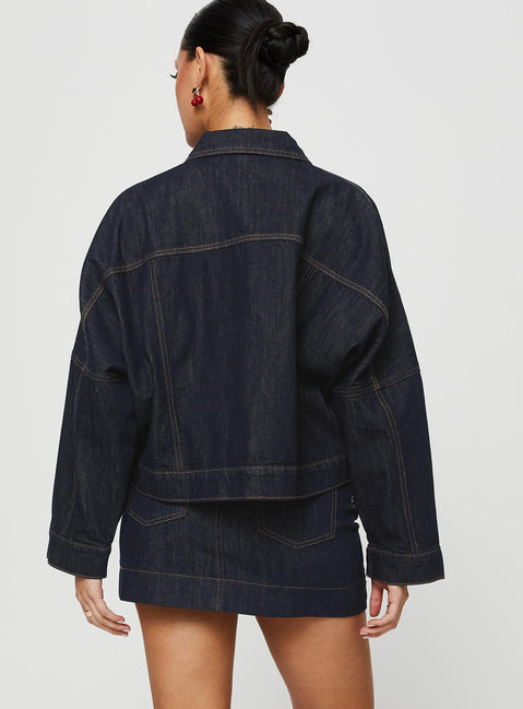 back view of model wearing Princess Polly Hughes Mini Skirt Dark Wash Denim Petite Mini Skirts 