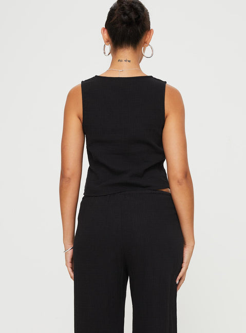 back view of model wearing Princess Polly Momo Vest Top Black Sleeveless Plunger 