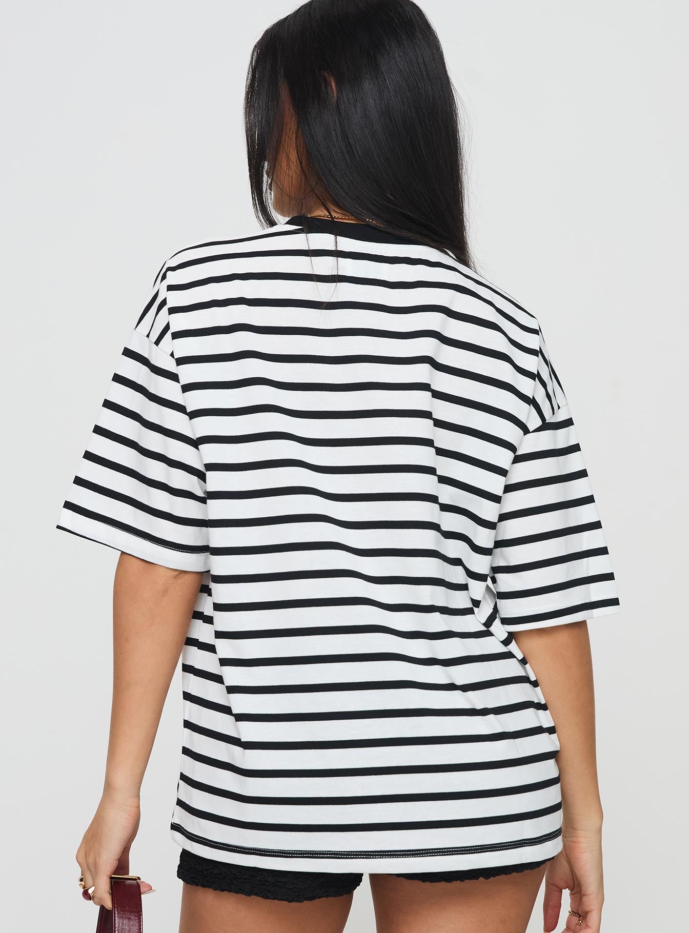 back view of model wearing Princess Polly Nersa Oversized Tee Black/white Stripe Half Sleeves Crew Neck 