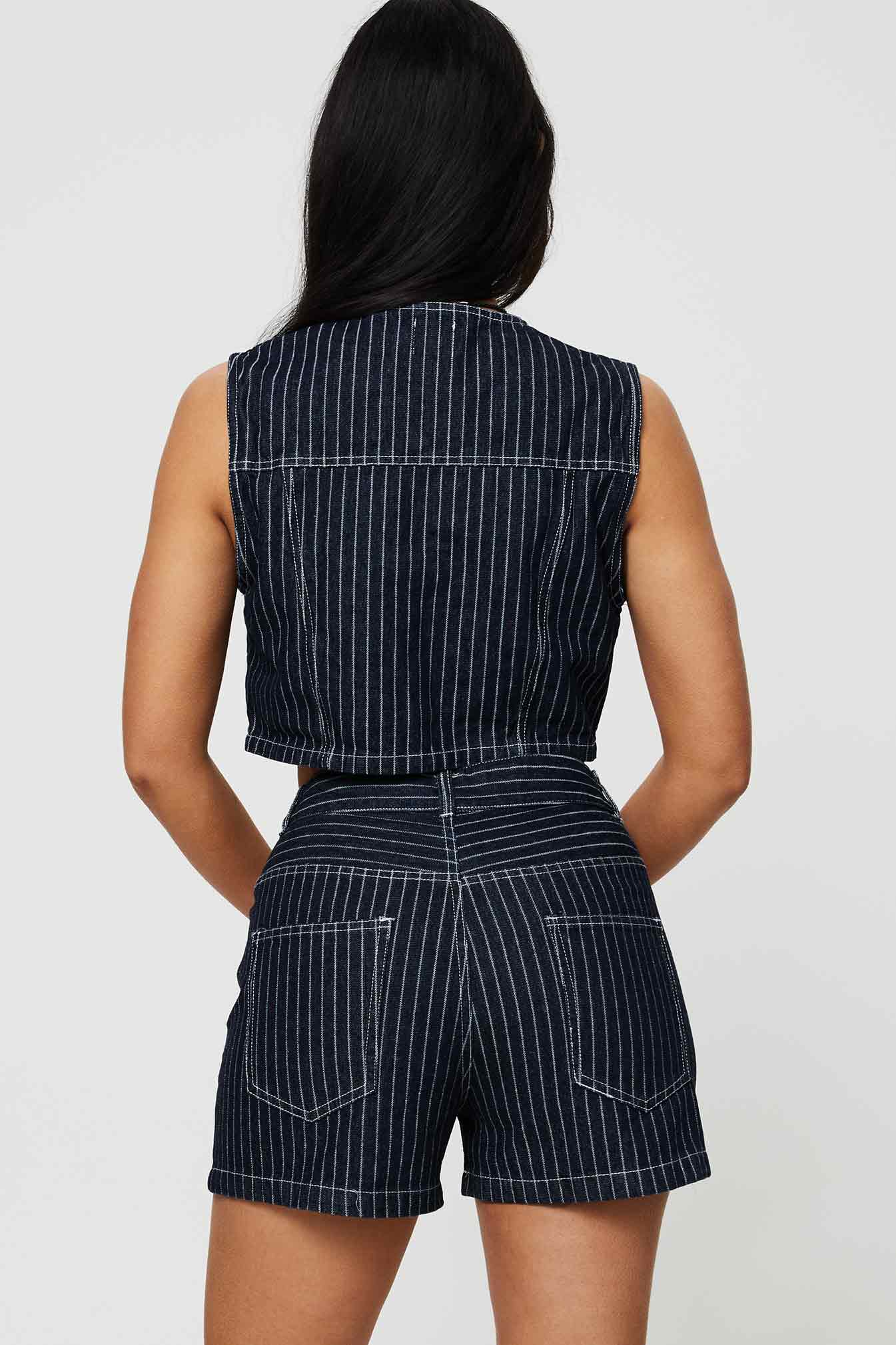 back view of model wearing Princess Polly Rathlyn Pinstripe Shorts Dark Denim High Waisted Shorts 