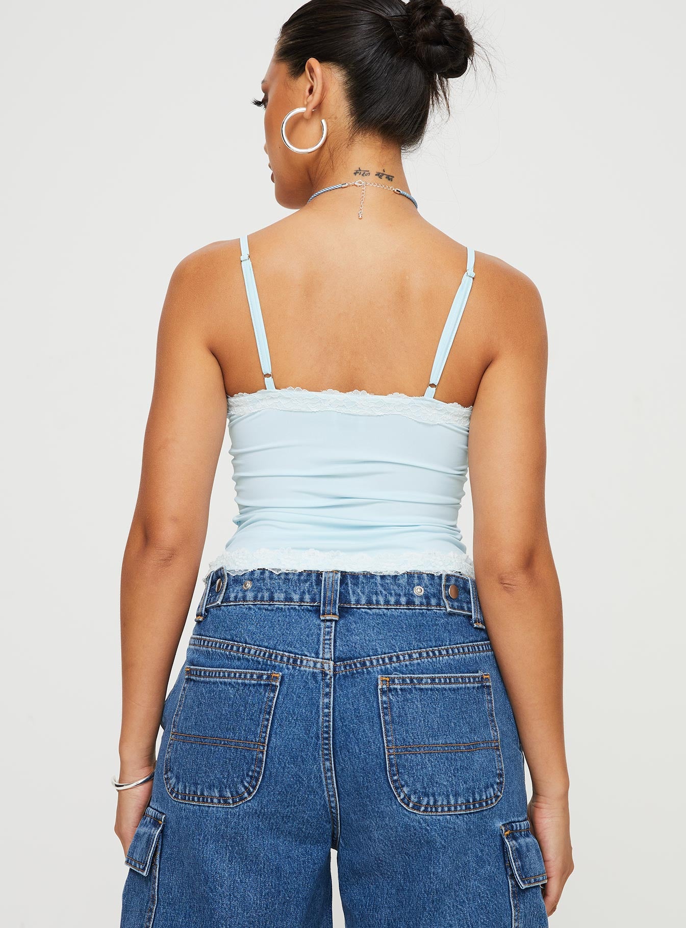 back view of model wearing Princess Polly Cinq Cami Top Baby Blue Sleeveless V-Neck 