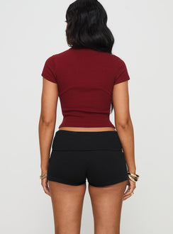 back view of model wearing Princess Polly Baseline Low Rise Rib Shorts Black High Waisted Shorts 