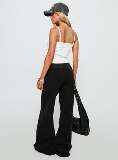 back view of model wearing Princess Polly Summits Flared Track Pants Washed Black High Waisted Pants 