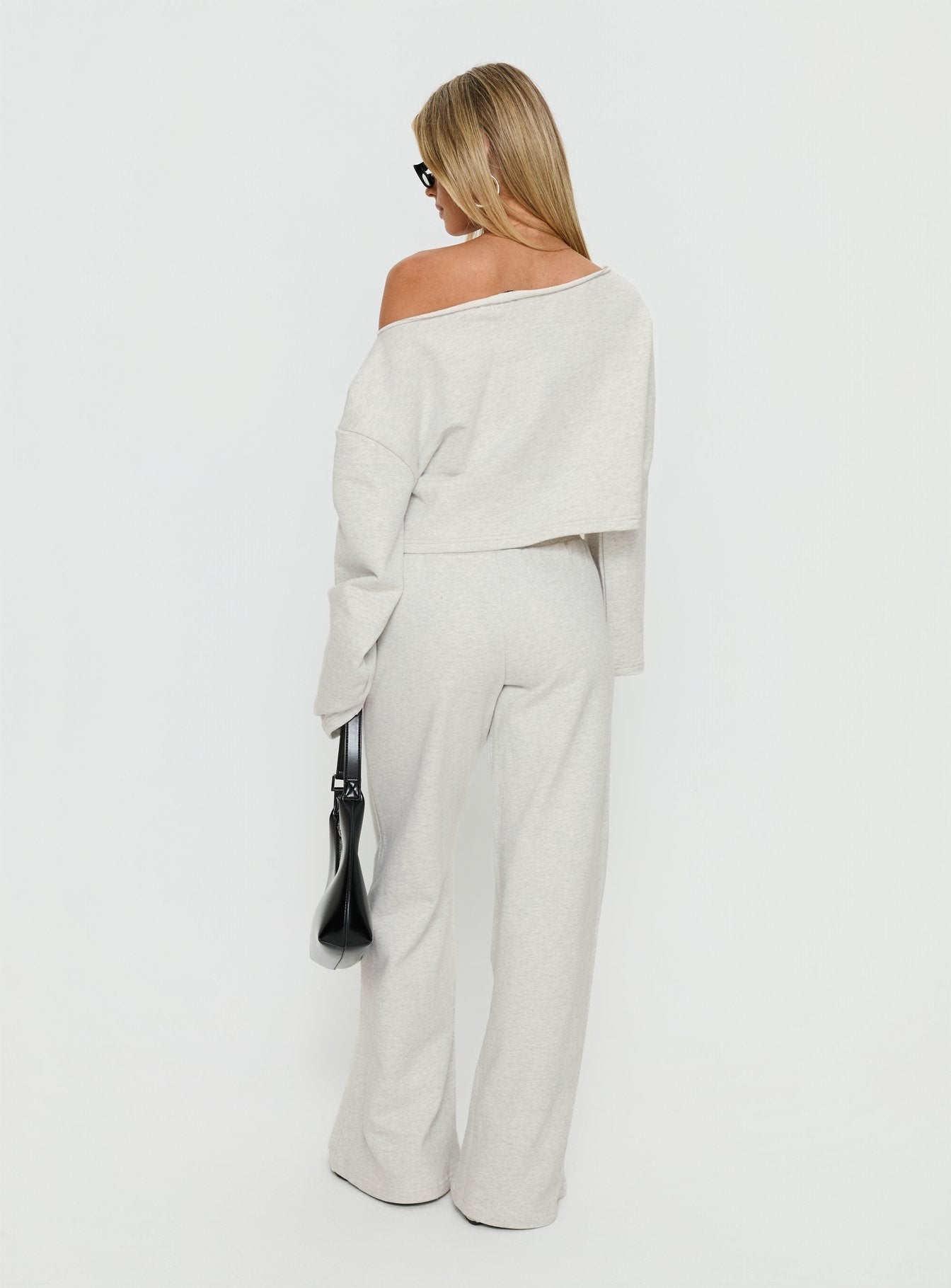 back view of model wearing Princess Polly Peaks Flared Track Pants Snow Marle Mid Rise Pants 