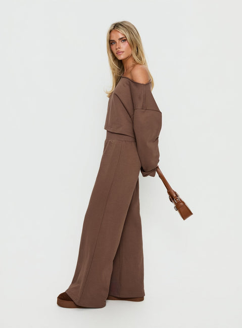 side view of model wearing Princess Polly Peaks Flared Track Pants Cocoa Mid Rise Pants 