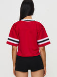 back view of model wearing Princess Polly SDSU Football Jersey Red Half Sleeves V-Neck 