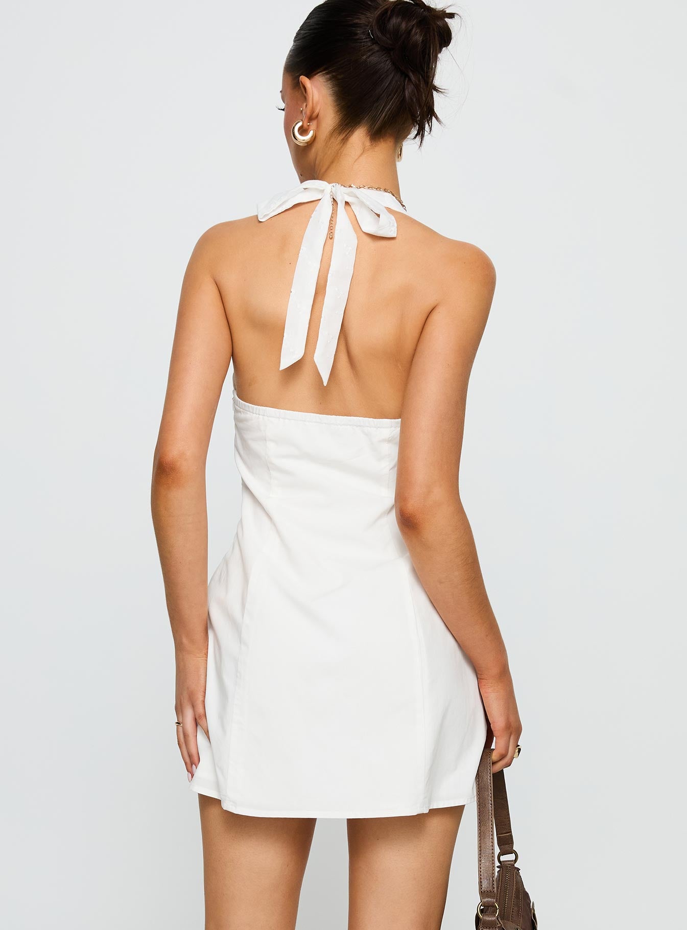 back view of model wearing Princess Polly Journey On Halter Mini Dress White Sweetheart Neckline 