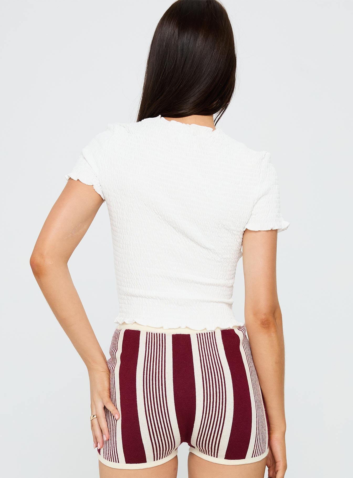 back view of model wearing Princess Polly Palm Reader Shirred Top White Short Sleeves Crew Neck 