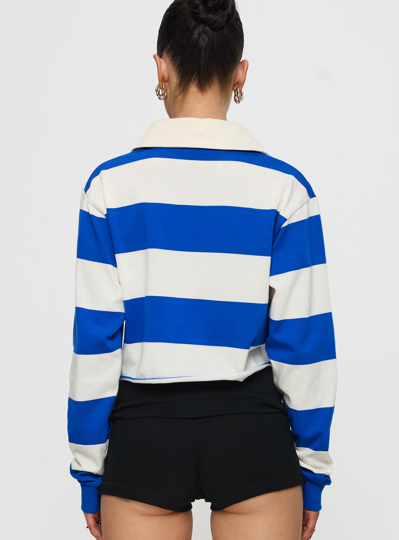 back view of model wearing Princess Polly UCSD Rugby Polo Navy / White Full Sleeves V-Neck 