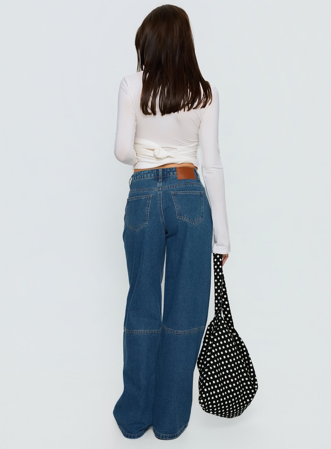 back view of model wearing Princess Polly Lando Low Rise Straight Leg Jeans Mid Blue Wash Mid Rise Jeans 