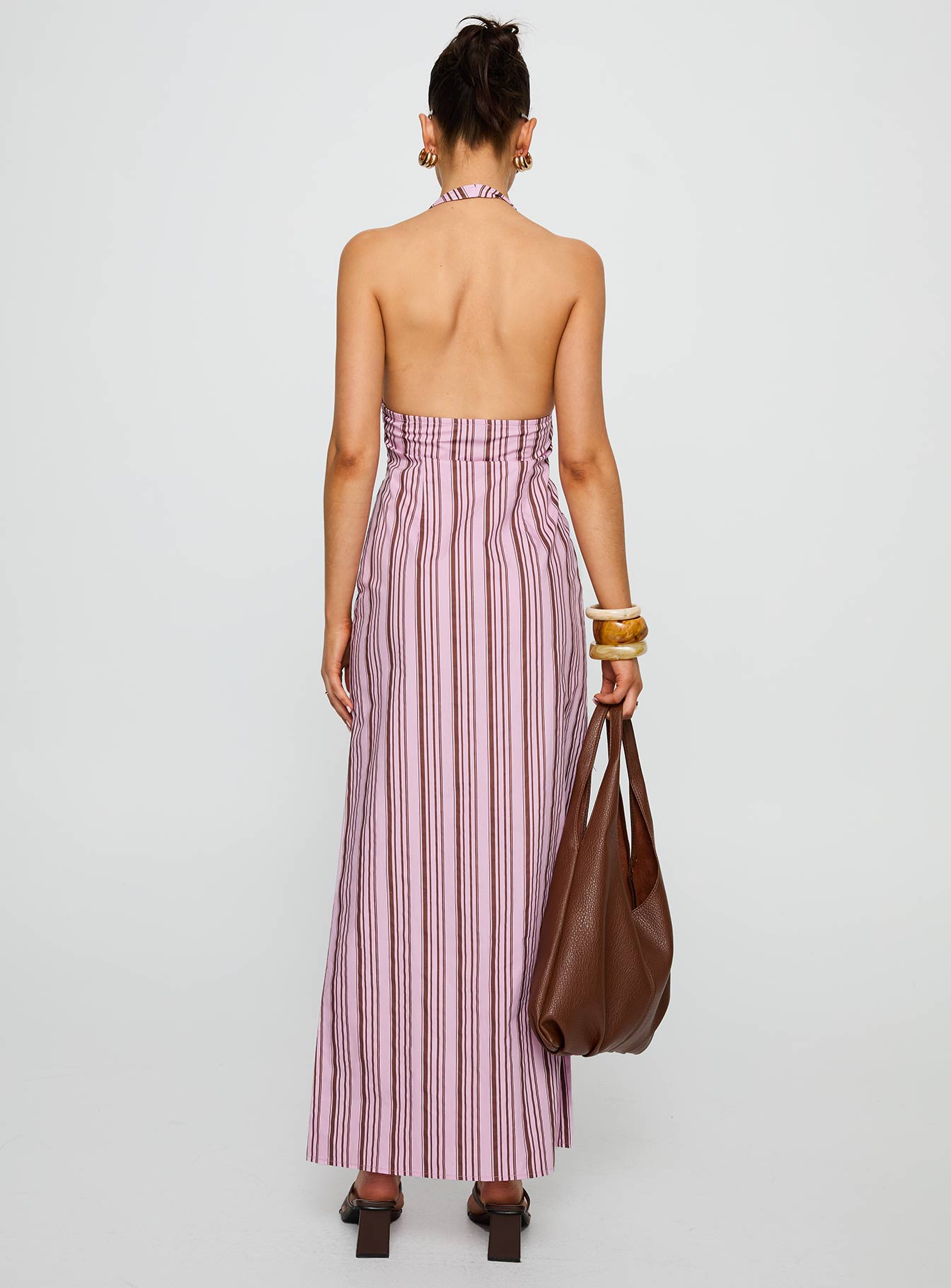 back view of model wearing Princess Polly Avrie Halter Maxi Dress Pink / Brown Stripe Plunger 