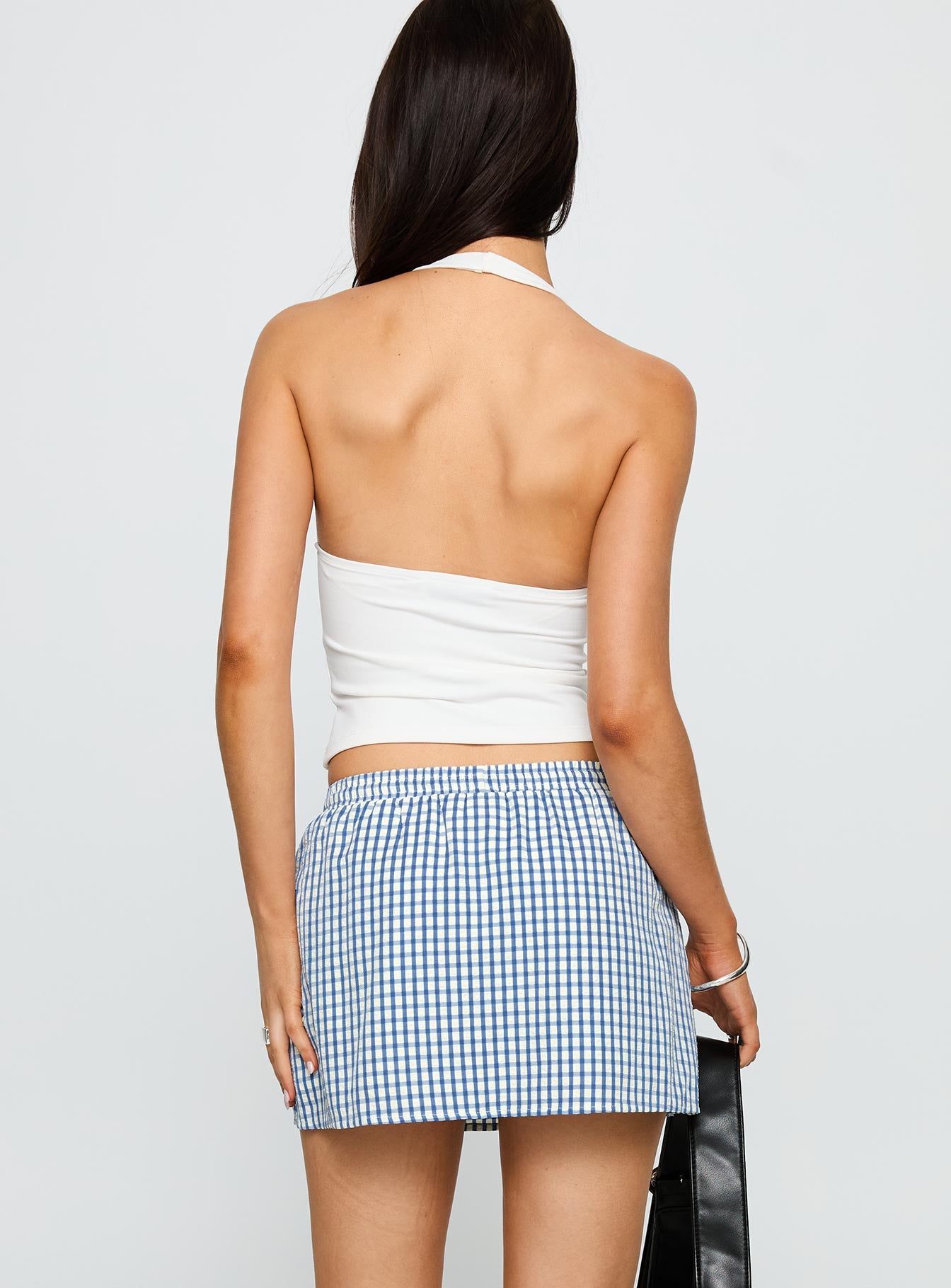 back view of model wearing Princess Polly My Way Skort Blue Gingham Low Rise Shorts 