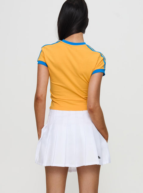 back view of model wearing Princess Polly UCLA Tennis Skort White 