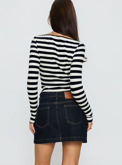 back view of model wearing Princess Polly Nickei Denim Mini Skirt Raw Dark Wash Mini Skirts 