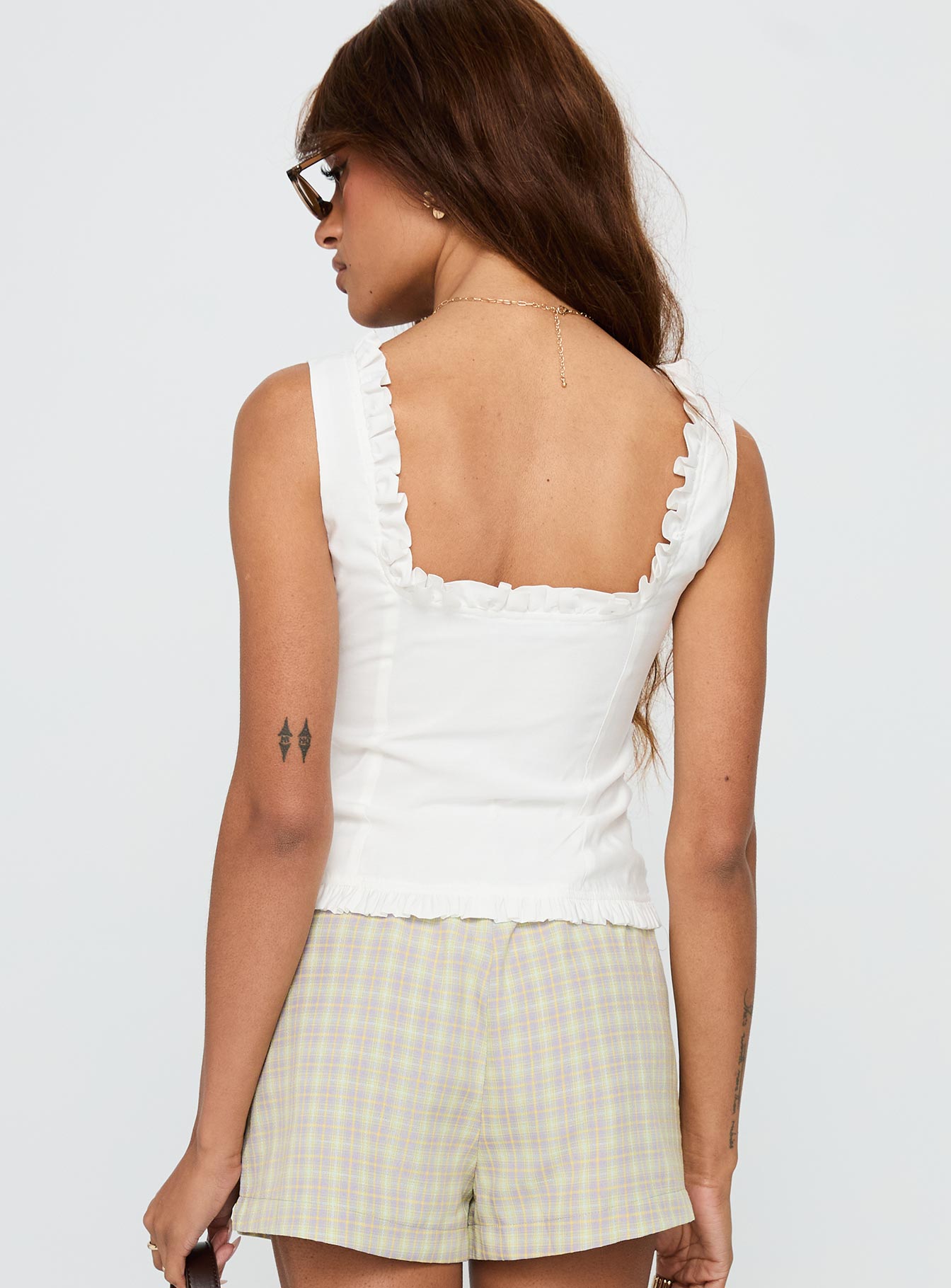 back view of model wearing Princess Polly Almeda Button Up Top White Sleeveless Scoop Neck 